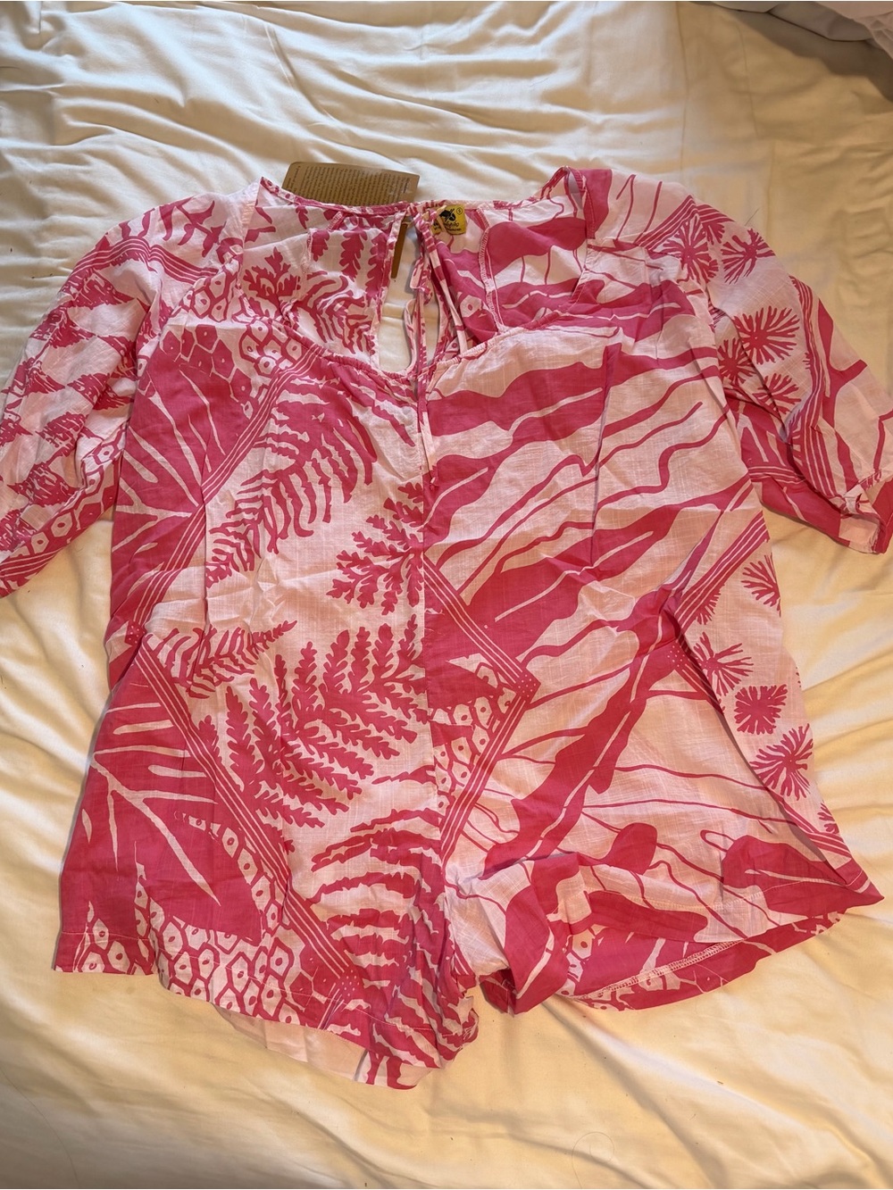 Pink Printed Short-Sleeve Romper with Tie Neck